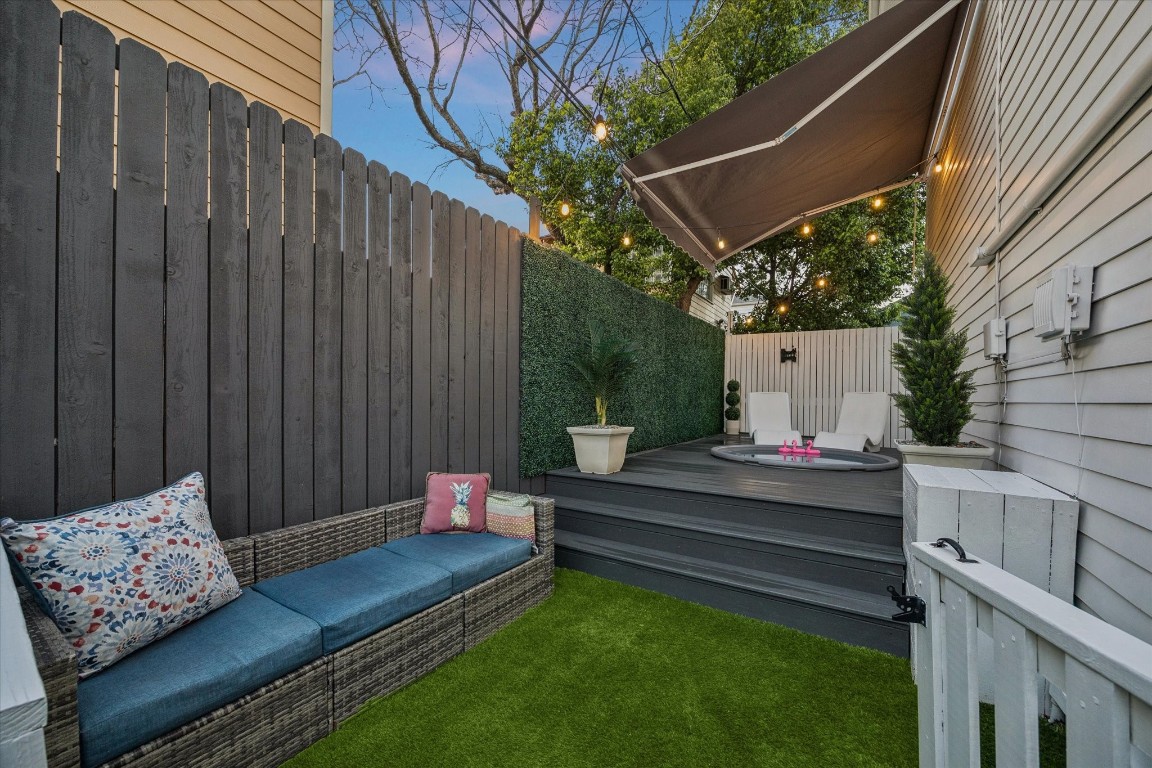 3535 Michaux Street Houston, TX 77009 - Photo 40 of 48 It's time for a soak in the cocktail pool! At the back of the property, you will find a cozy, fenced outdoor space featuring raised deck with a small soaking pool. String lights and an awning add ambiance, while privacy is ensured with fencing and greenery. Perfect for relaxation and entertaining!