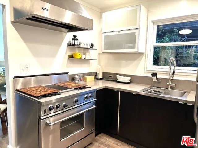 a kitchen with a stove and a sink