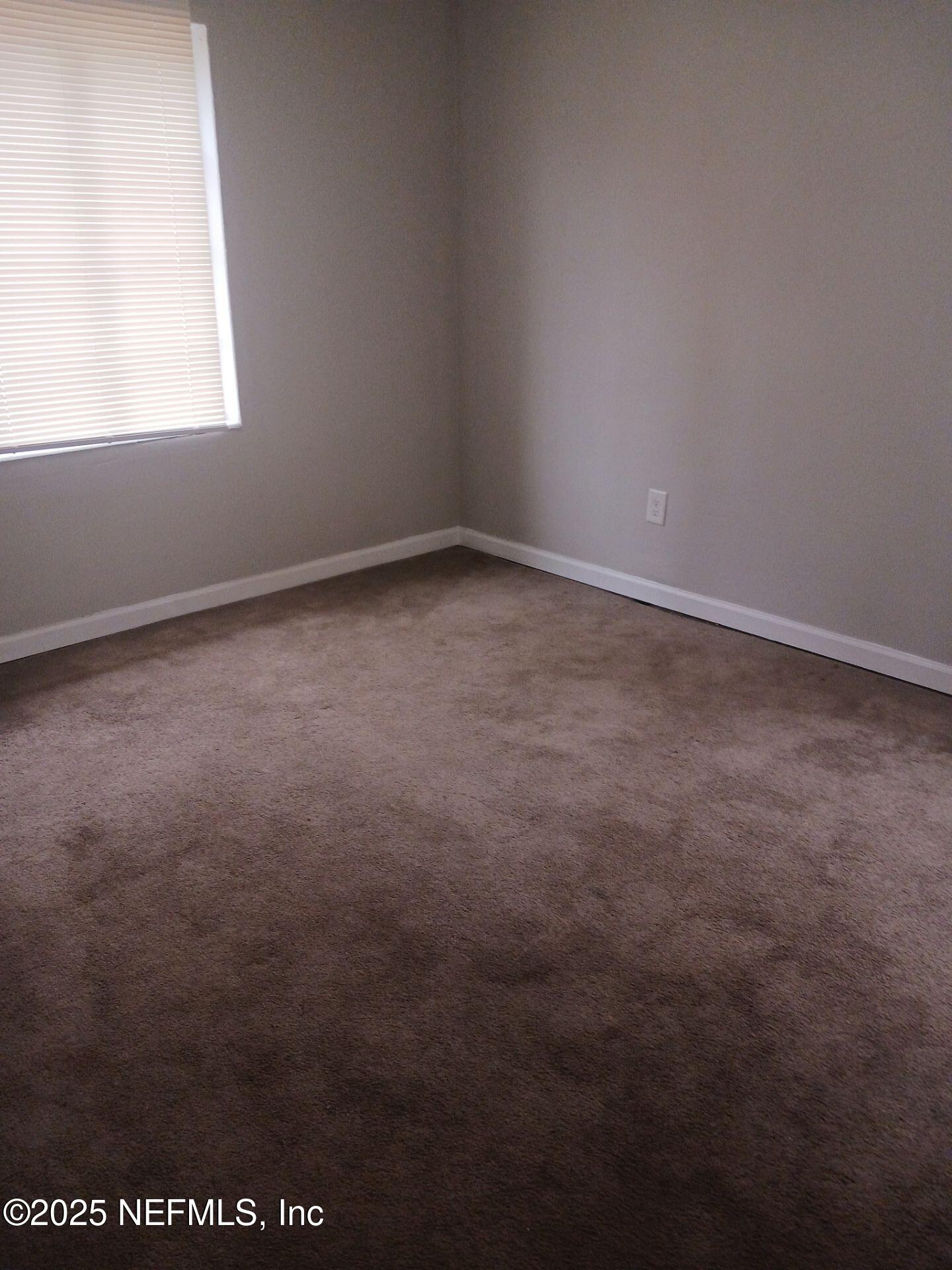 1669 Stafford Road Jacksonville, FL 32208 - Photo 11 of 17 an empty room with a window