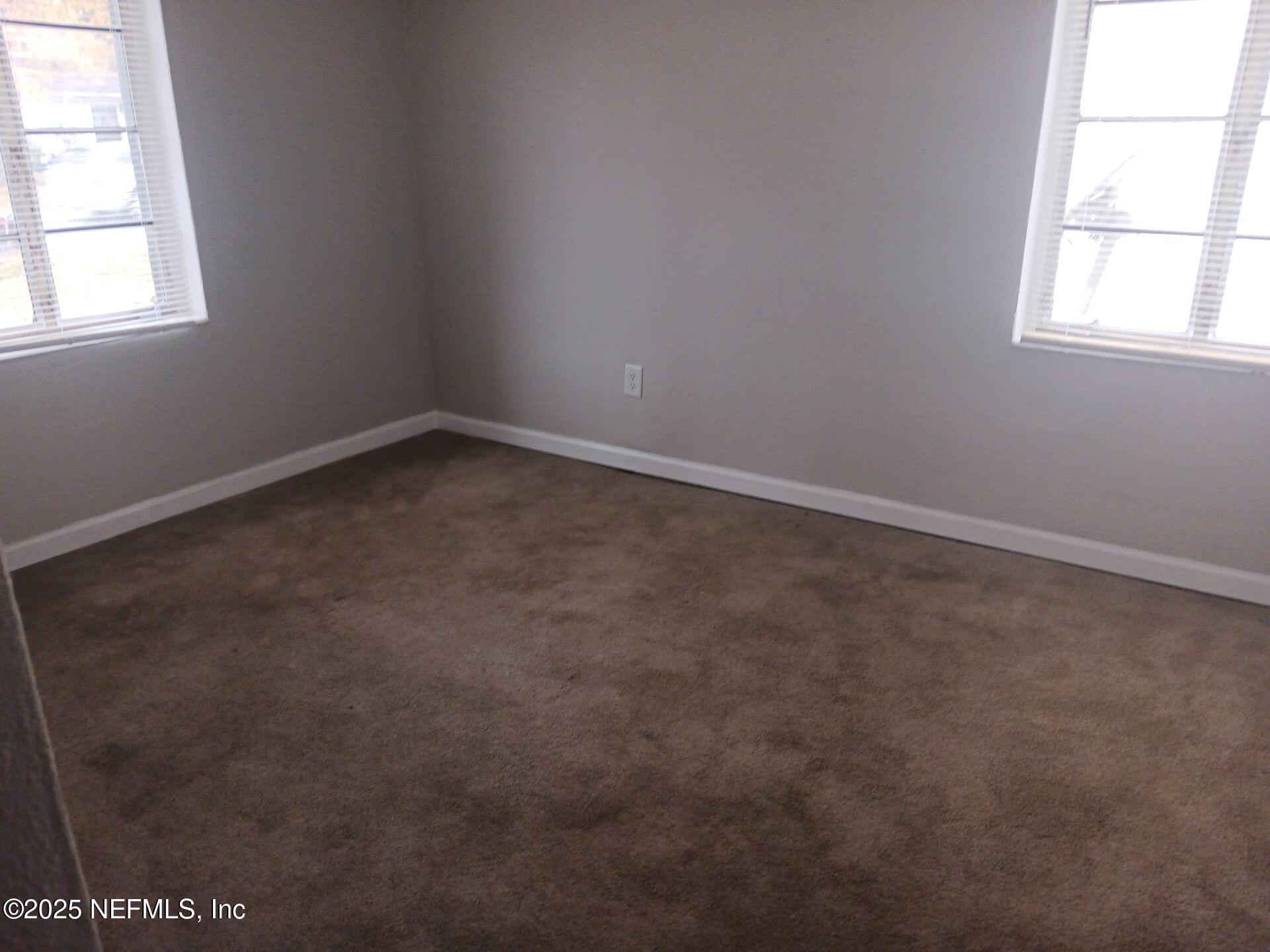 1669 Stafford Road Jacksonville, FL 32208 - Photo 12 of 17 an empty room with a window