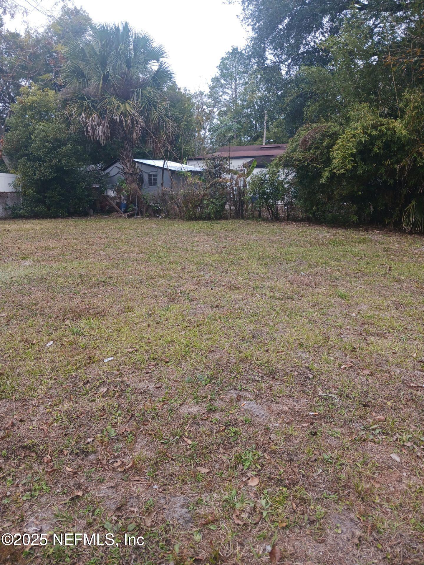 1669 Stafford Road Jacksonville, FL 32208 - Photo 16 of 17 a view of a field with trees in the background