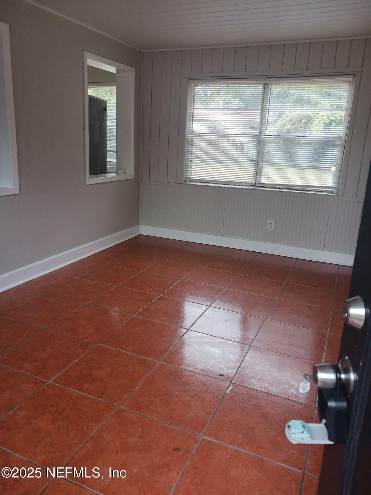 1669 Stafford Road Jacksonville, FL 32208 - Photo 3 of 17 a view of an empty room with windows