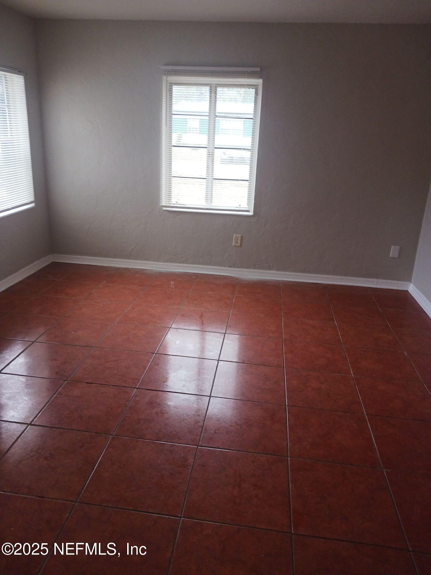 1669 Stafford Road Jacksonville, FL 32208 - Photo 4 of 17 a view of an empty room with a window