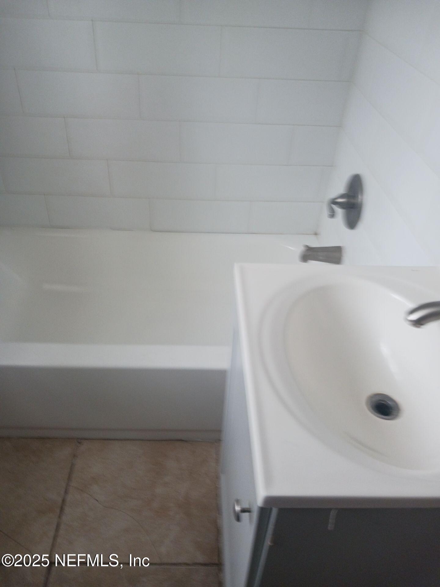 1669 Stafford Road Jacksonville, FL 32208 - Photo 7 of 17 a close up of a bathtub
