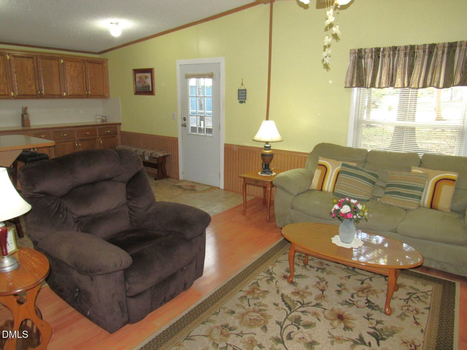 34 Waters Edge Cove Henderson, NC 27537 - Photo 16 of 44 a living room with furniture and a table