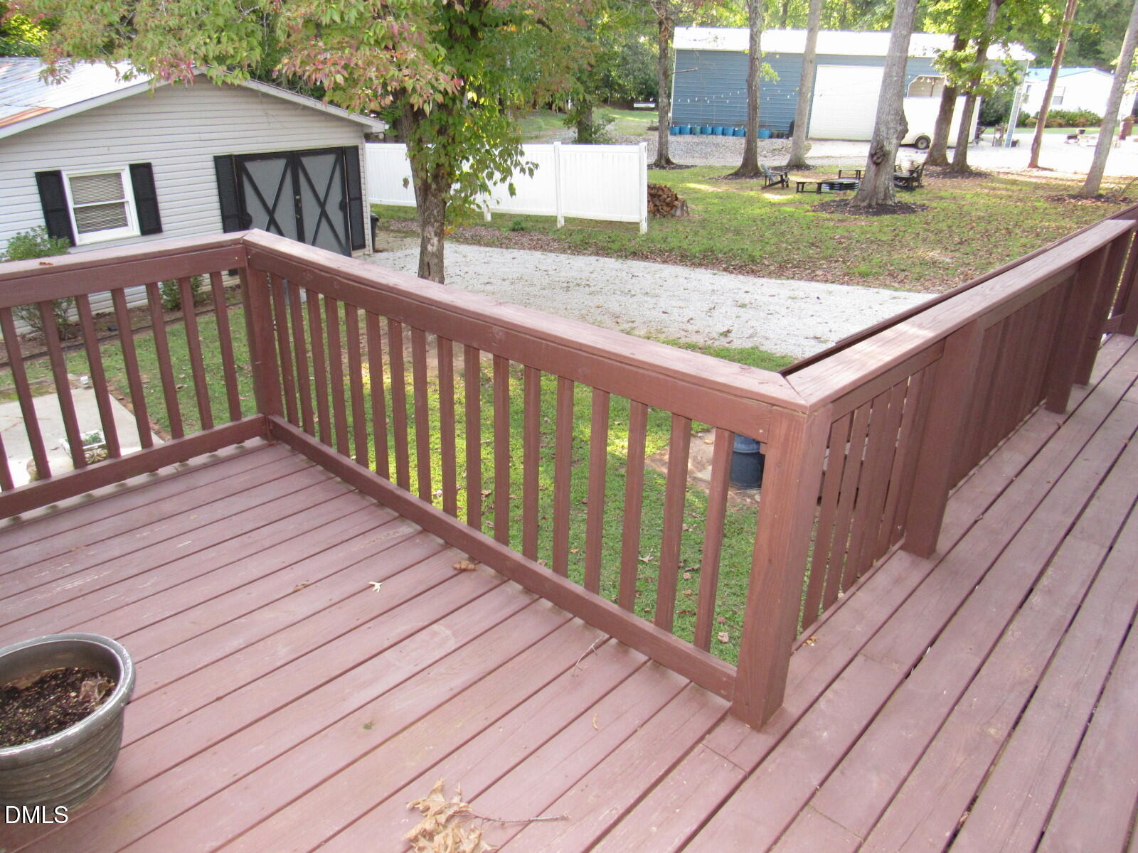 34 Waters Edge Cove Henderson, NC 27537 - Photo 30 of 44 a view of a wooden deck and a yard