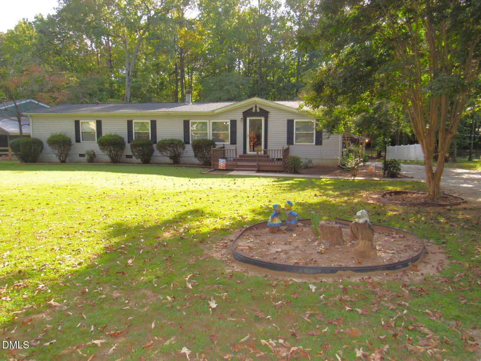 34 Waters Edge Cove Henderson, NC 27537 - Photo 3 of 44 a house with swimming pool in front of it