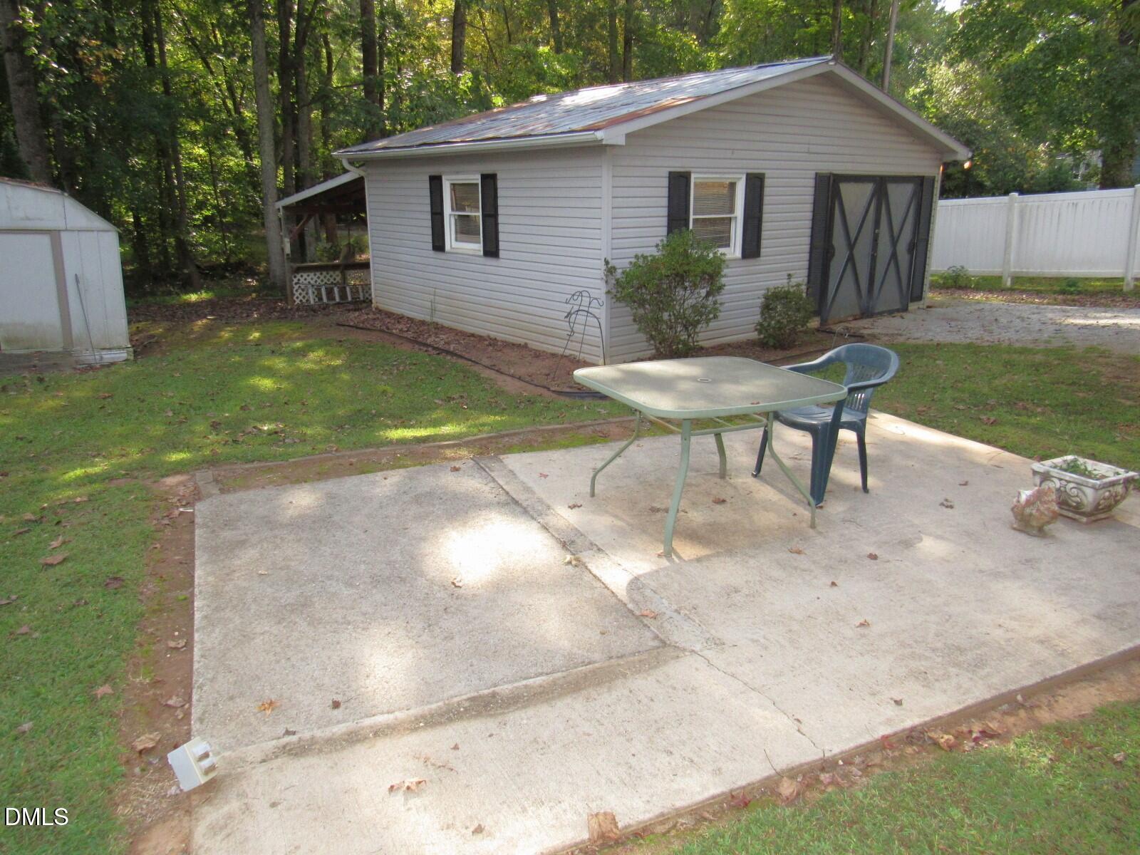 34 Waters Edge Cove Henderson, NC 27537 - Photo 31 of 44 a view of a house with backyard and sitting area