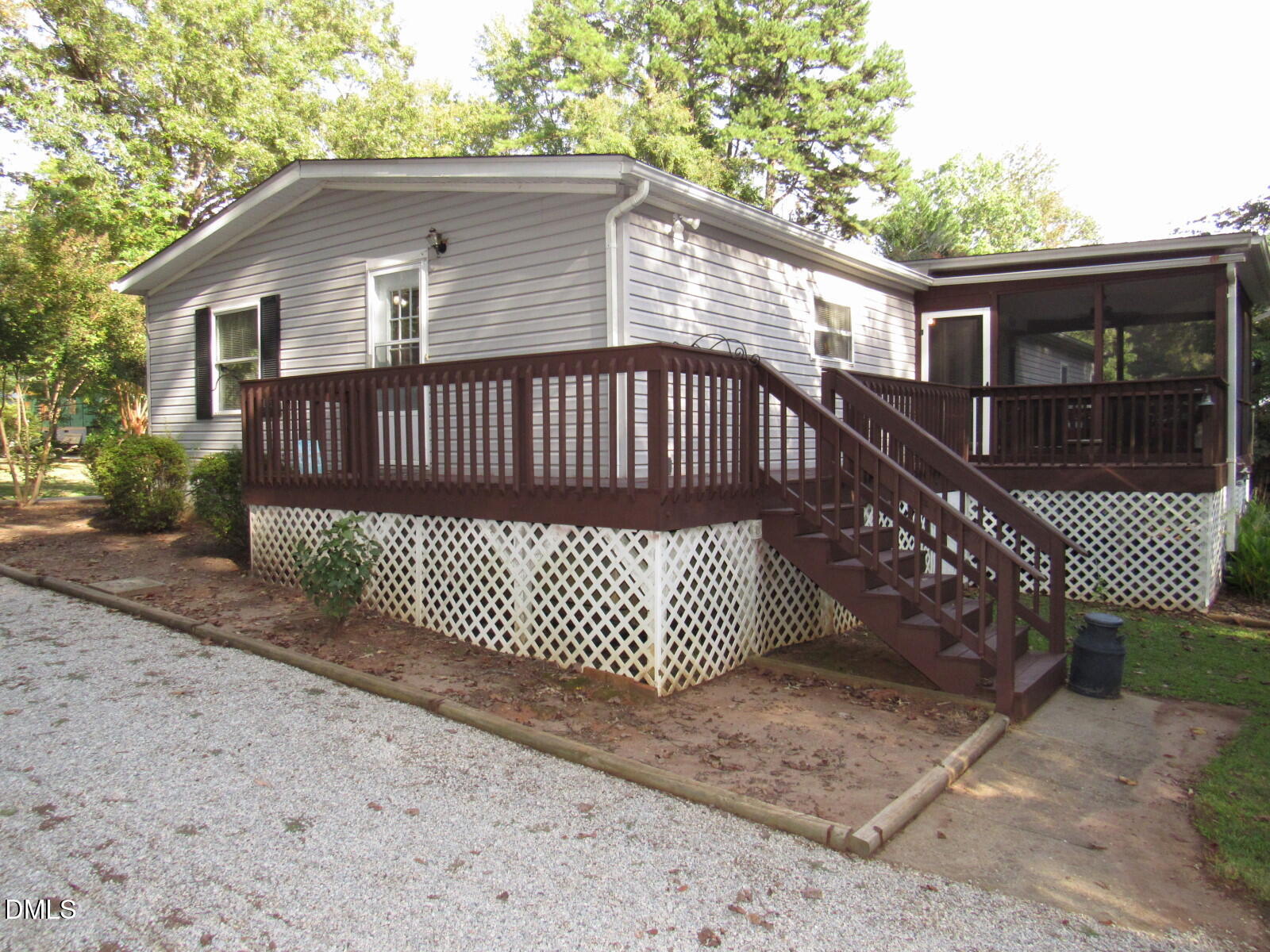 34 Waters Edge Cove Henderson, NC 27537 - Photo 5 of 44 a front view of a house with a garden