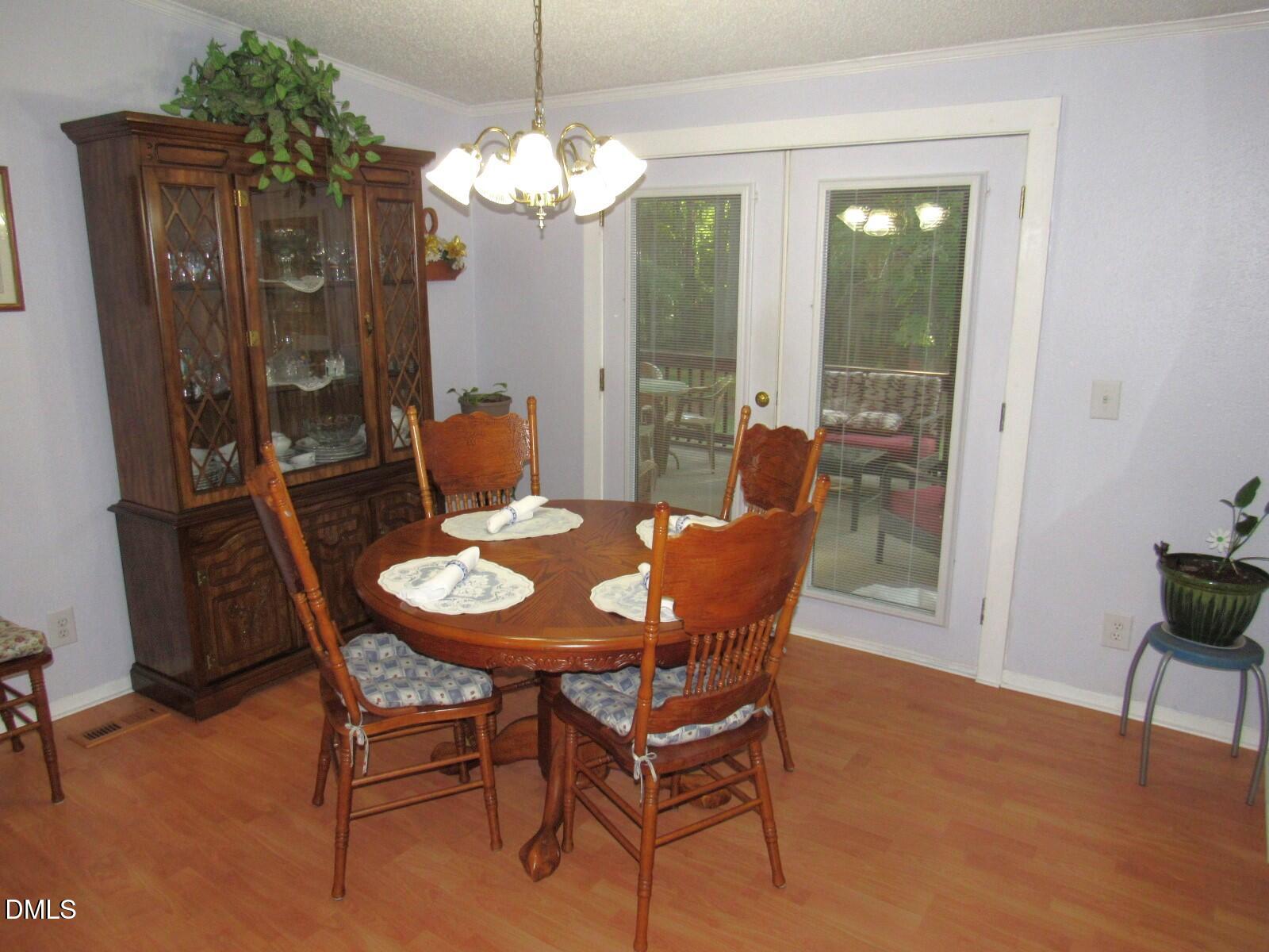 34 Waters Edge Cove Henderson, NC 27537 - Photo 9 of 44 a view of a dining room with furniture and window