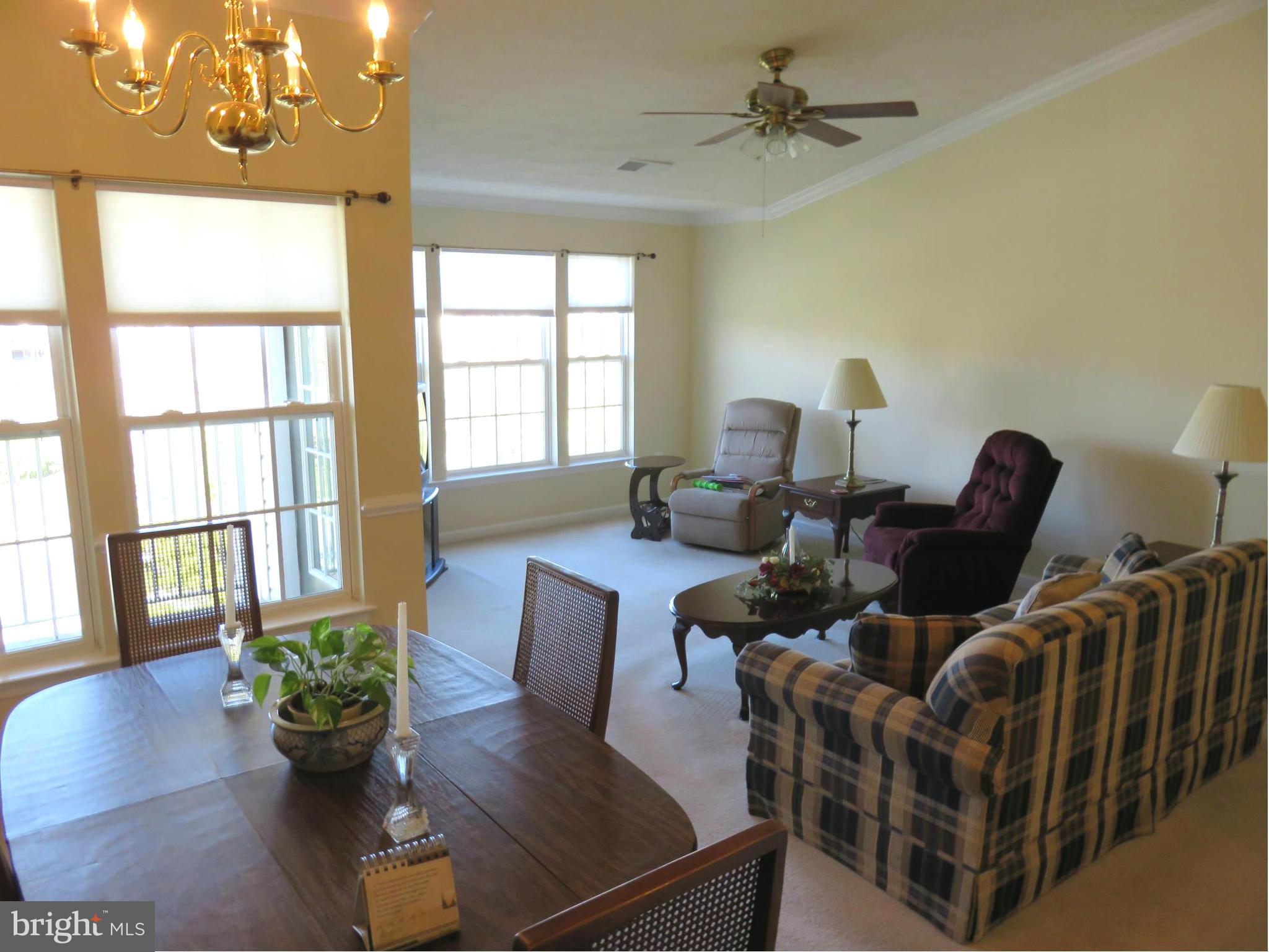 9604 Haven Farm Road, Unit K Perry Hall, MD 21128 - Photo 24 of 24 a view of a dining room with furniture a potted plant and wooden floor
