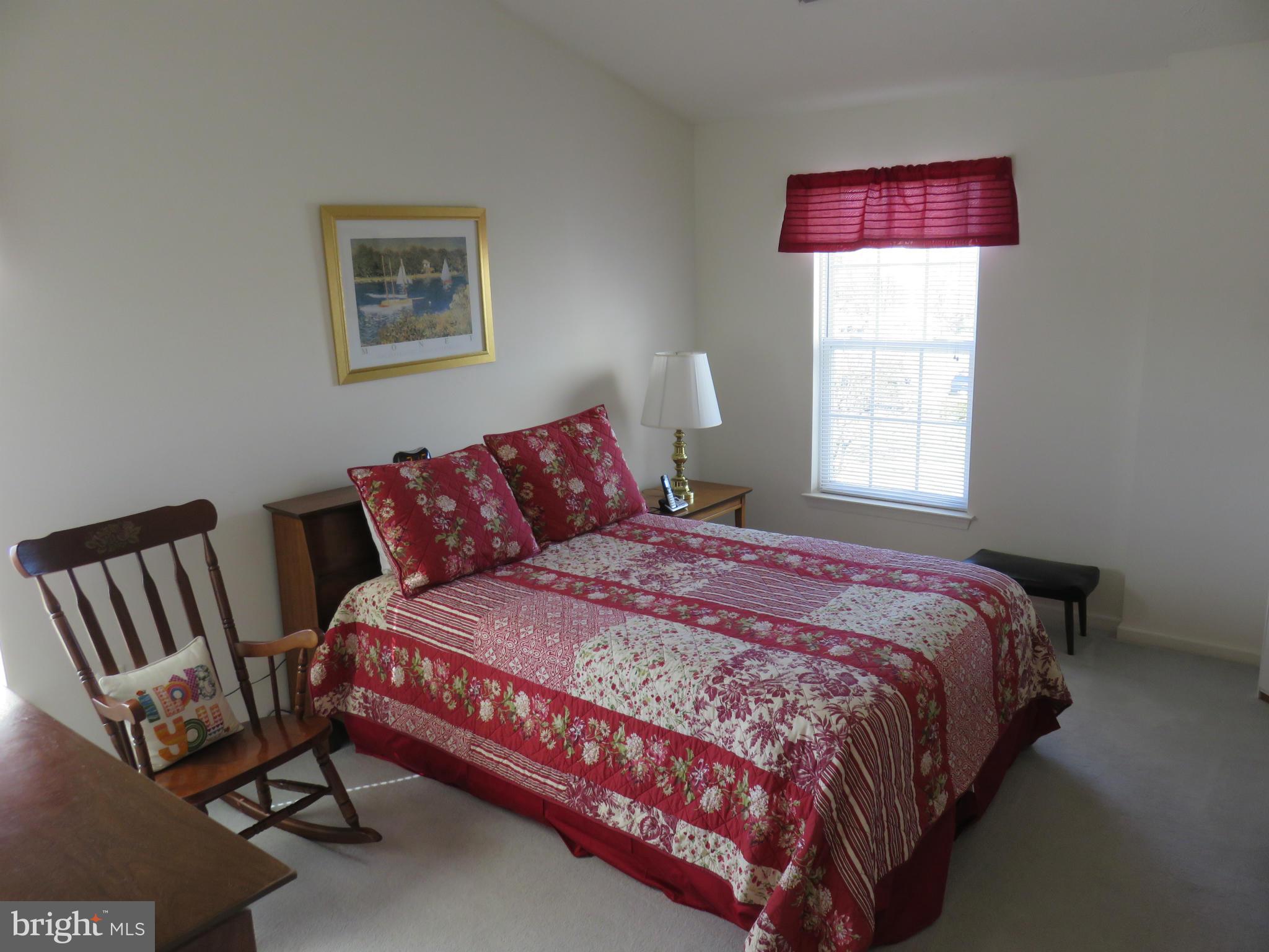 9604 Haven Farm Road, Unit K Perry Hall, MD 21128 - Photo 12 of 24 a bedroom with a bed chair and window
