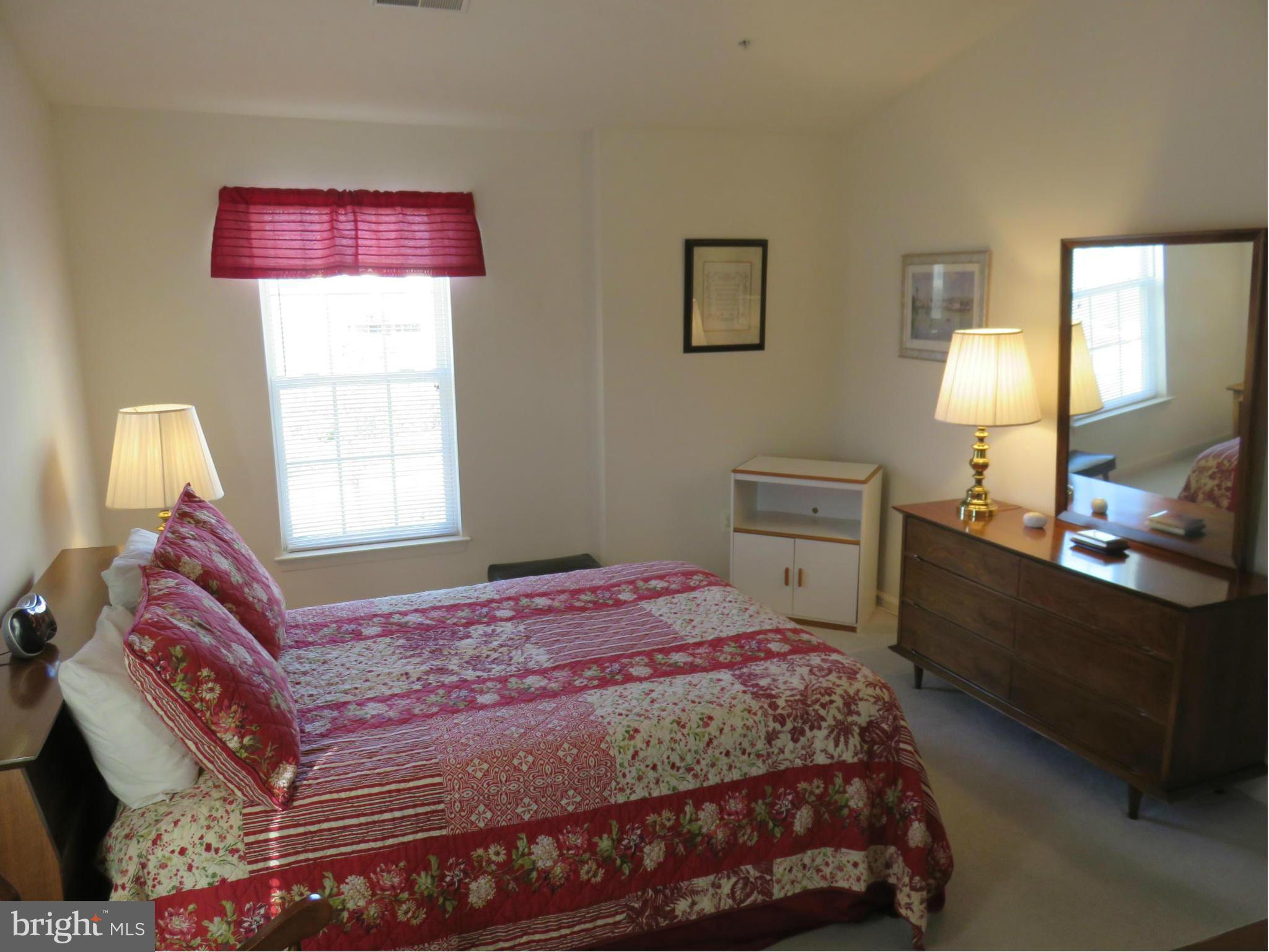9604 Haven Farm Road, Unit K Perry Hall, MD 21128 - Photo 13 of 24 a bedroom with a bed and a window