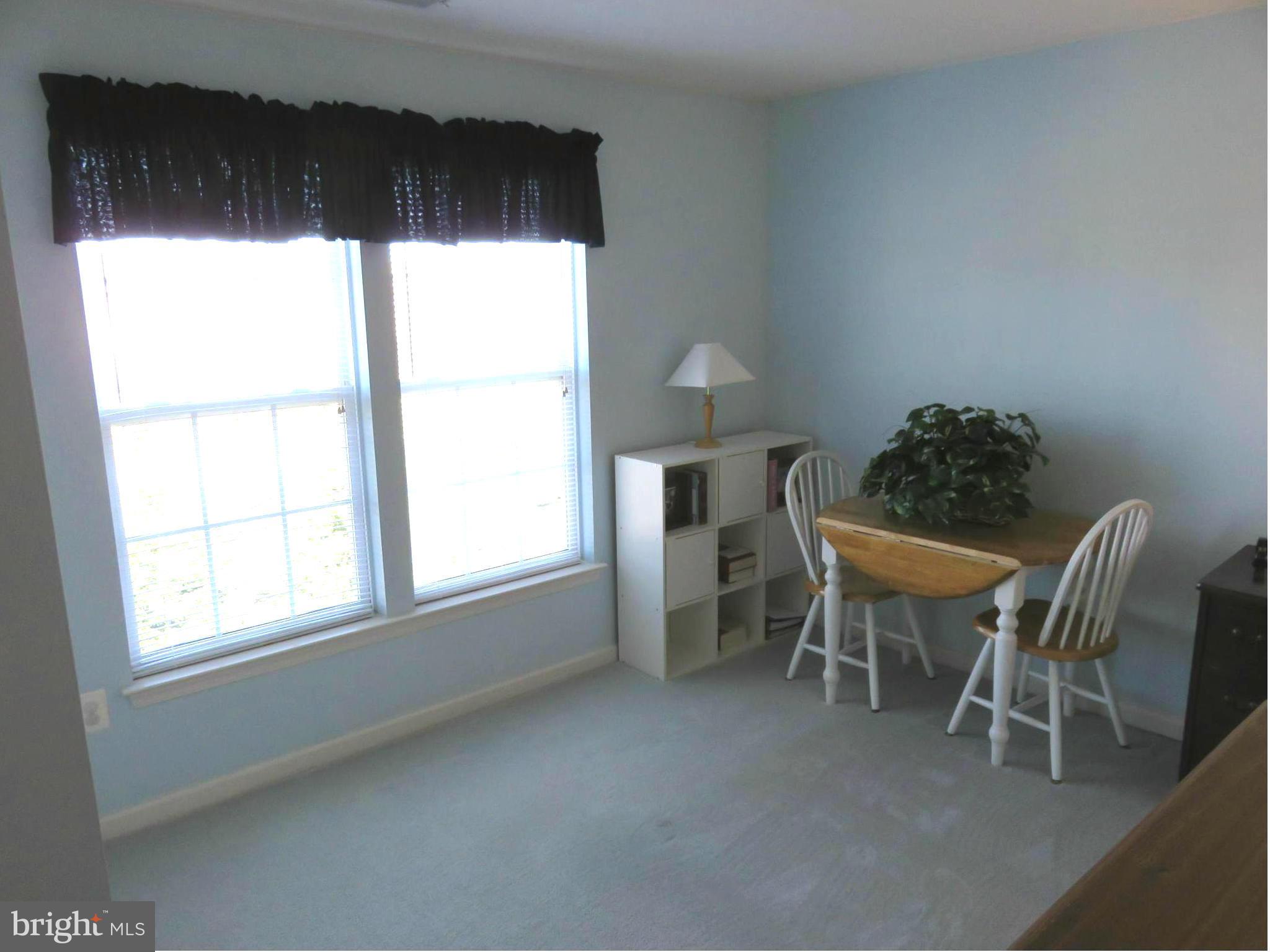 9604 Haven Farm Road, Unit K Perry Hall, MD 21128 - Photo 16 of 24 a dining room with furniture and window