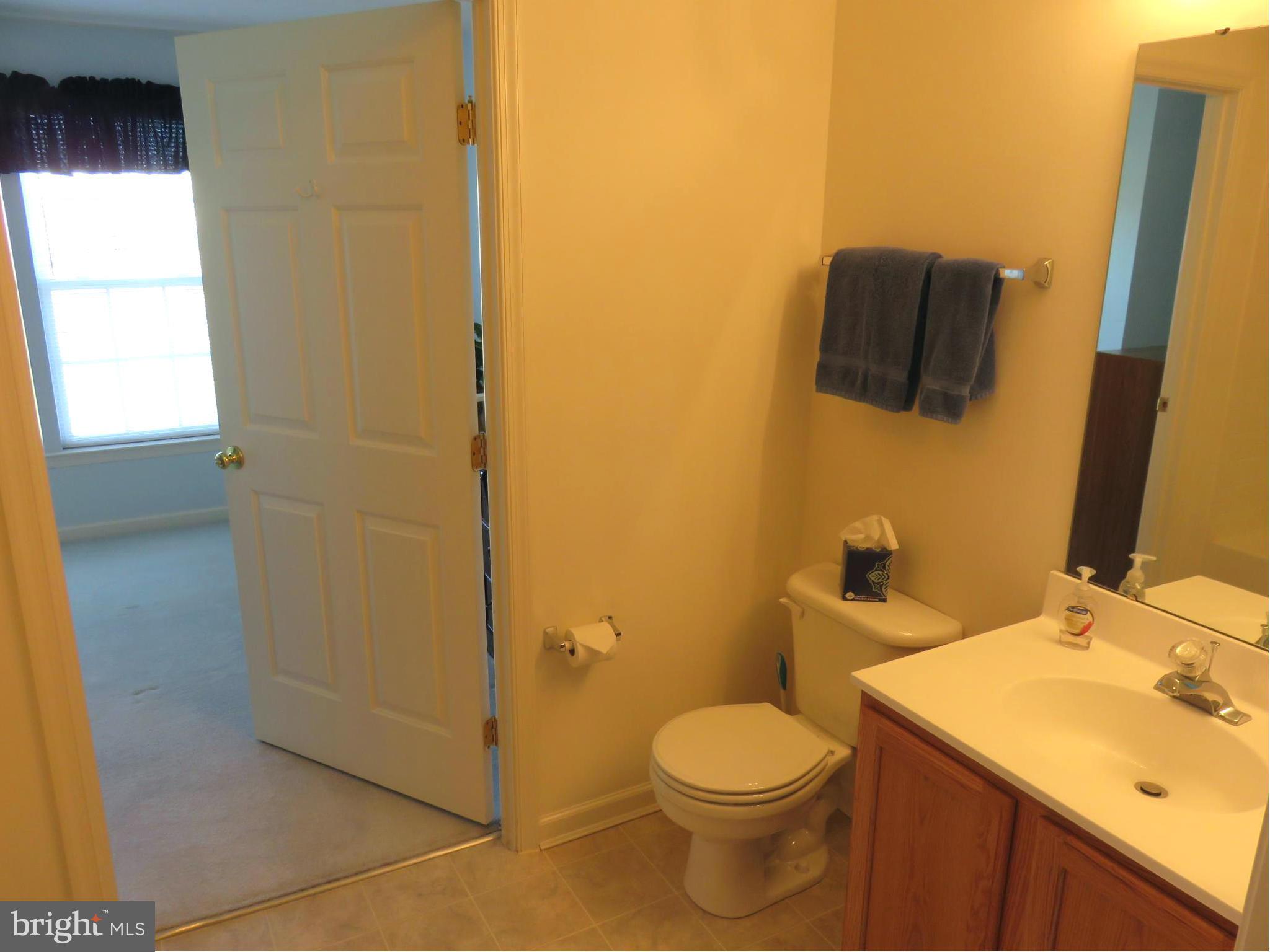 9604 Haven Farm Road, Unit K Perry Hall, MD 21128 - Photo 17 of 24 a bathroom with a sink and a mirror
