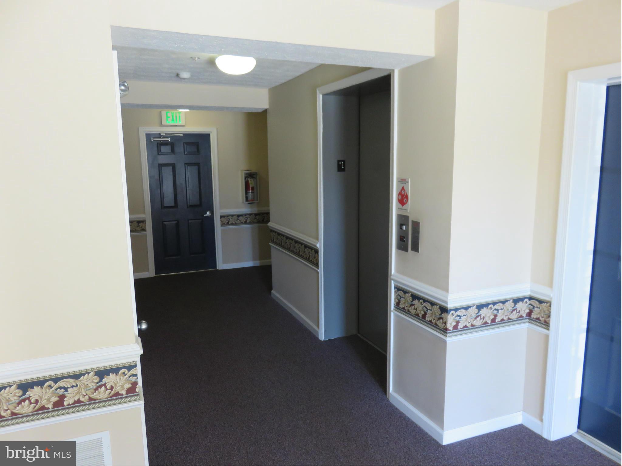 9604 Haven Farm Road, Unit K Perry Hall, MD 21128 - Photo 18 of 24 a view of a hallway with a kitchen