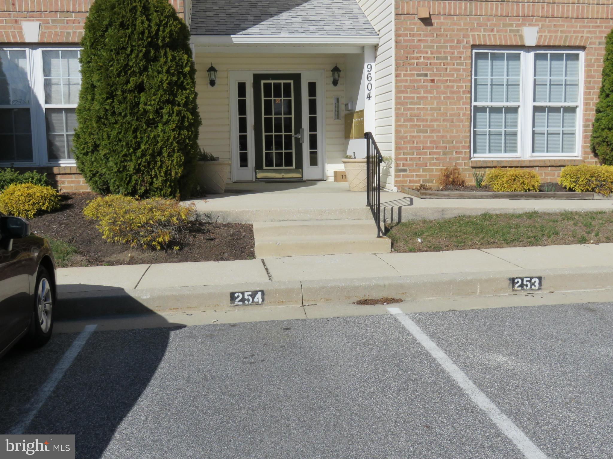 9604 Haven Farm Road, Unit K Perry Hall, MD 21128 - Photo 20 of 24 front view of a house with a yard