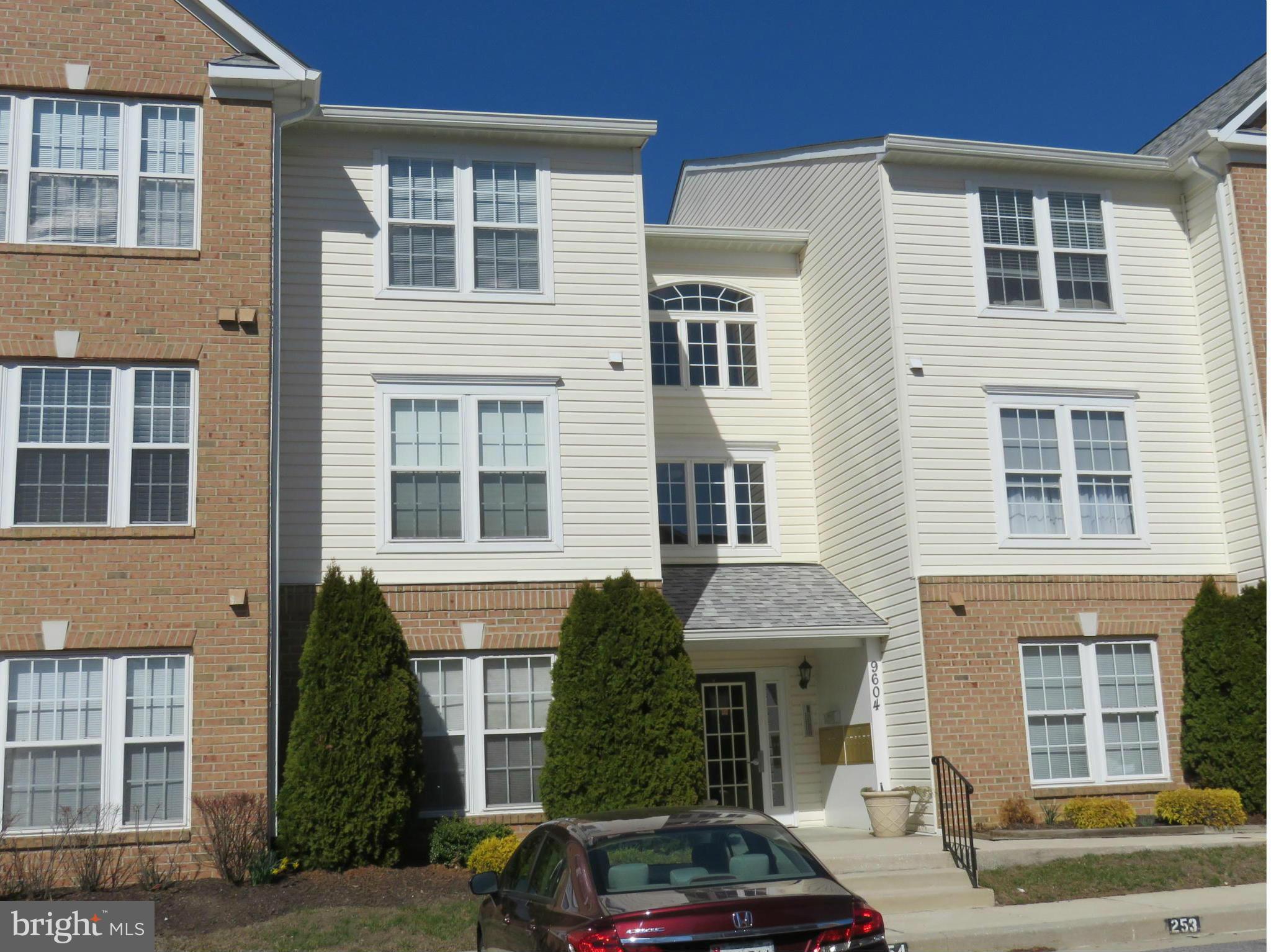 9604 Haven Farm Road, Unit K Perry Hall, MD 21128 - Photo 22 of 24 a front view of a house with car parked