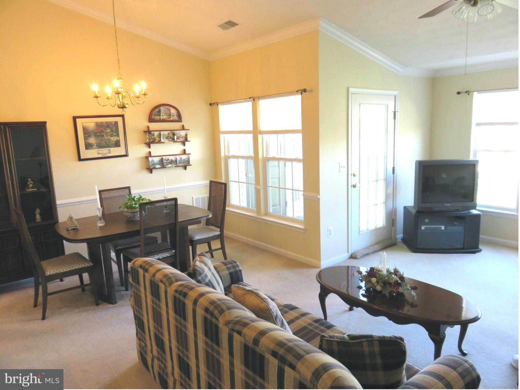9604 Haven Farm Road, Unit K Perry Hall, MD 21128 - Photo 8 of 24 a living room with furniture a flat screen tv and a window