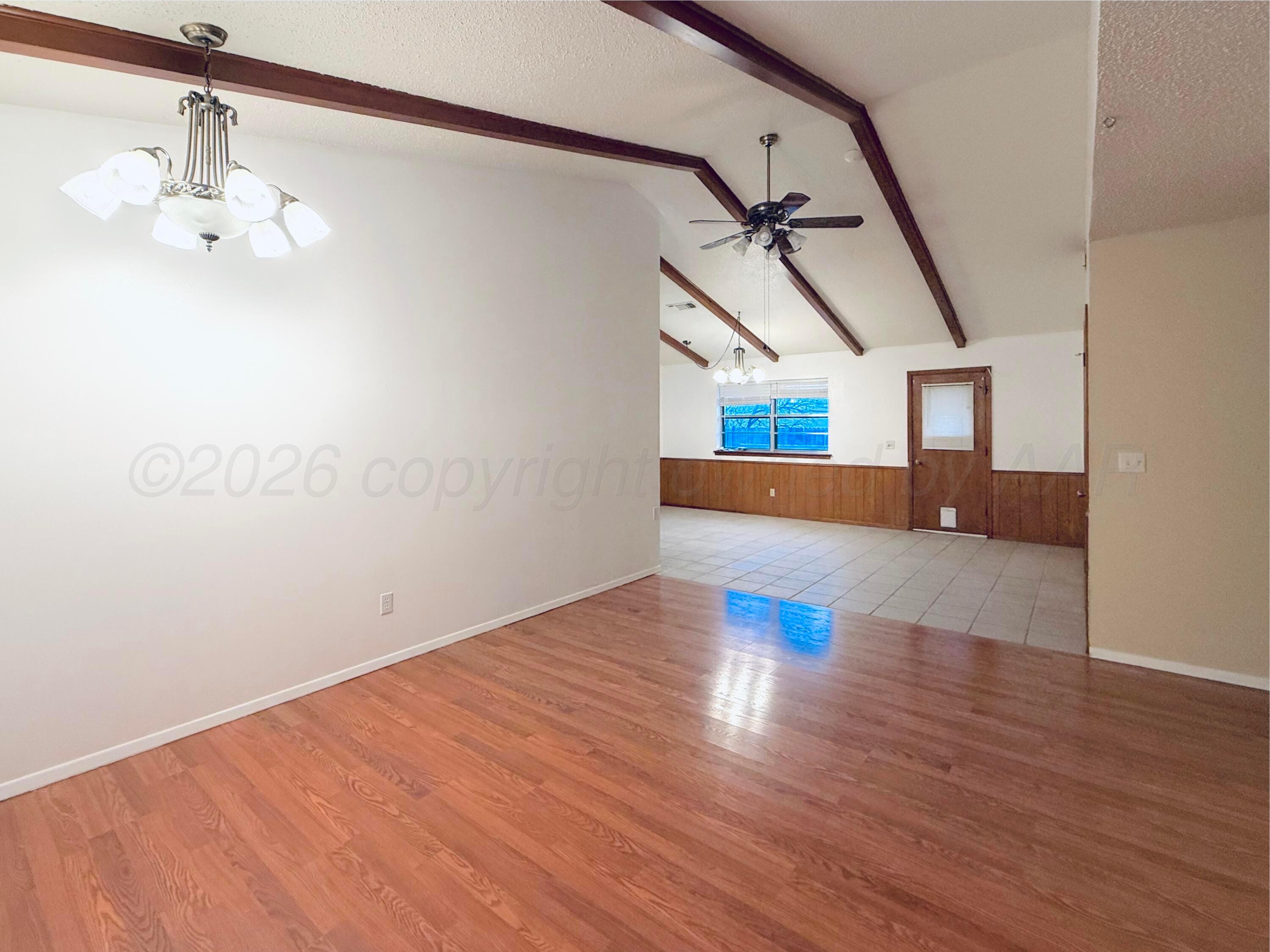 1713 Sunset Avenue Dumas, TX 79029 - Photo 5 of 15 a view of empty room with wooden floor and fan