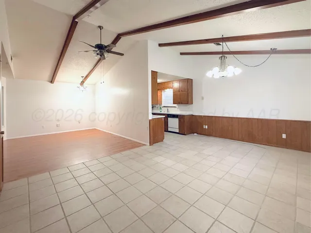 a large kitchen with stainless steel appliances granite countertop a large counter top and stove