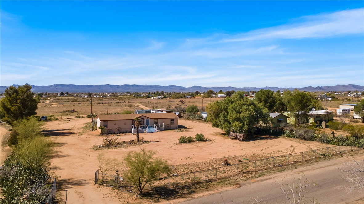 3411 Mayer Road Golden Valley, AZ 86413 - Photo 2 of 49 Mountain view featuring rural landscape and a desert landscape