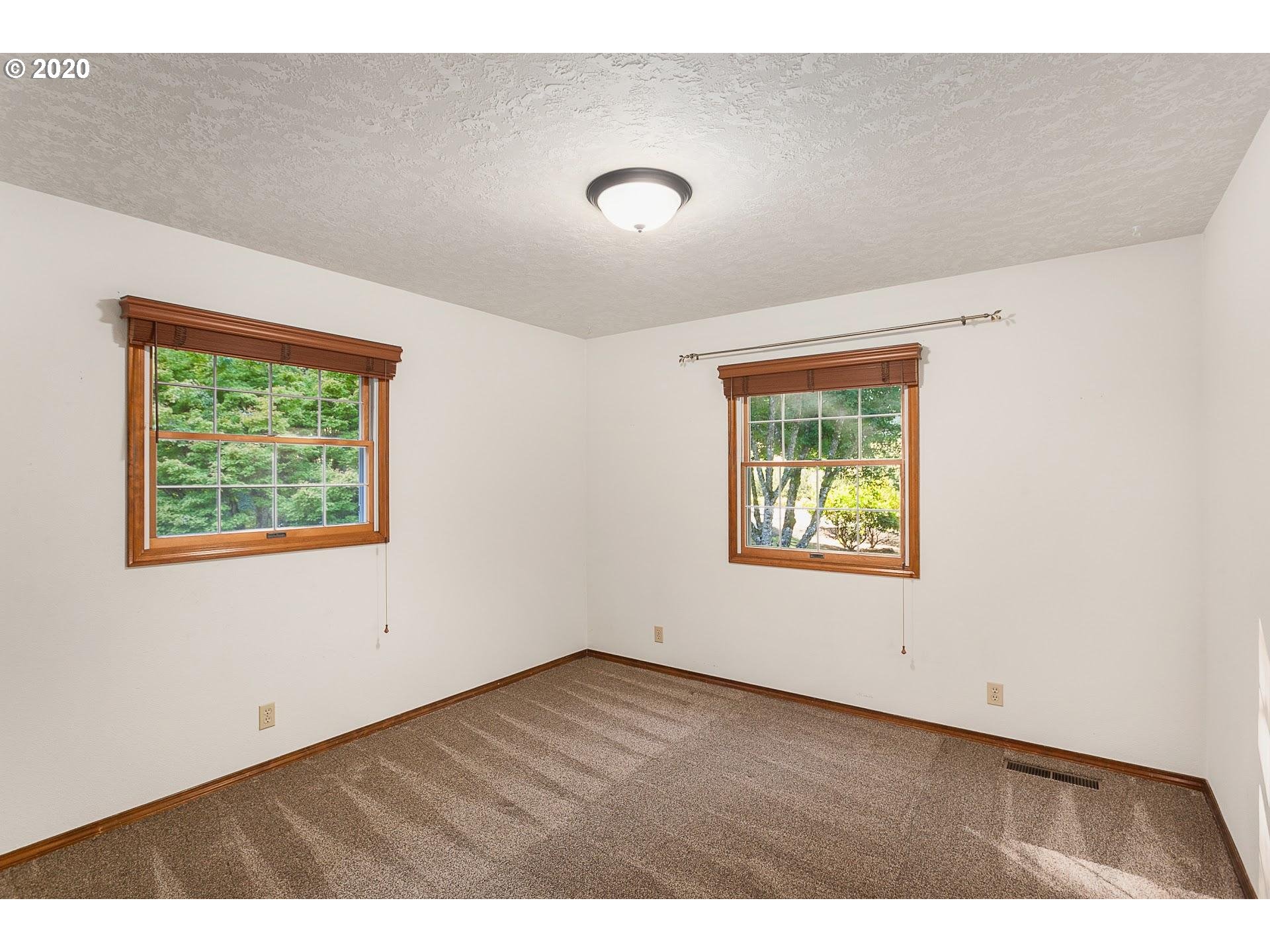 18740 Southwest Seiffert Road Sherwood, OR 97140 - Photo 14 of 32 a view of an empty room with a window