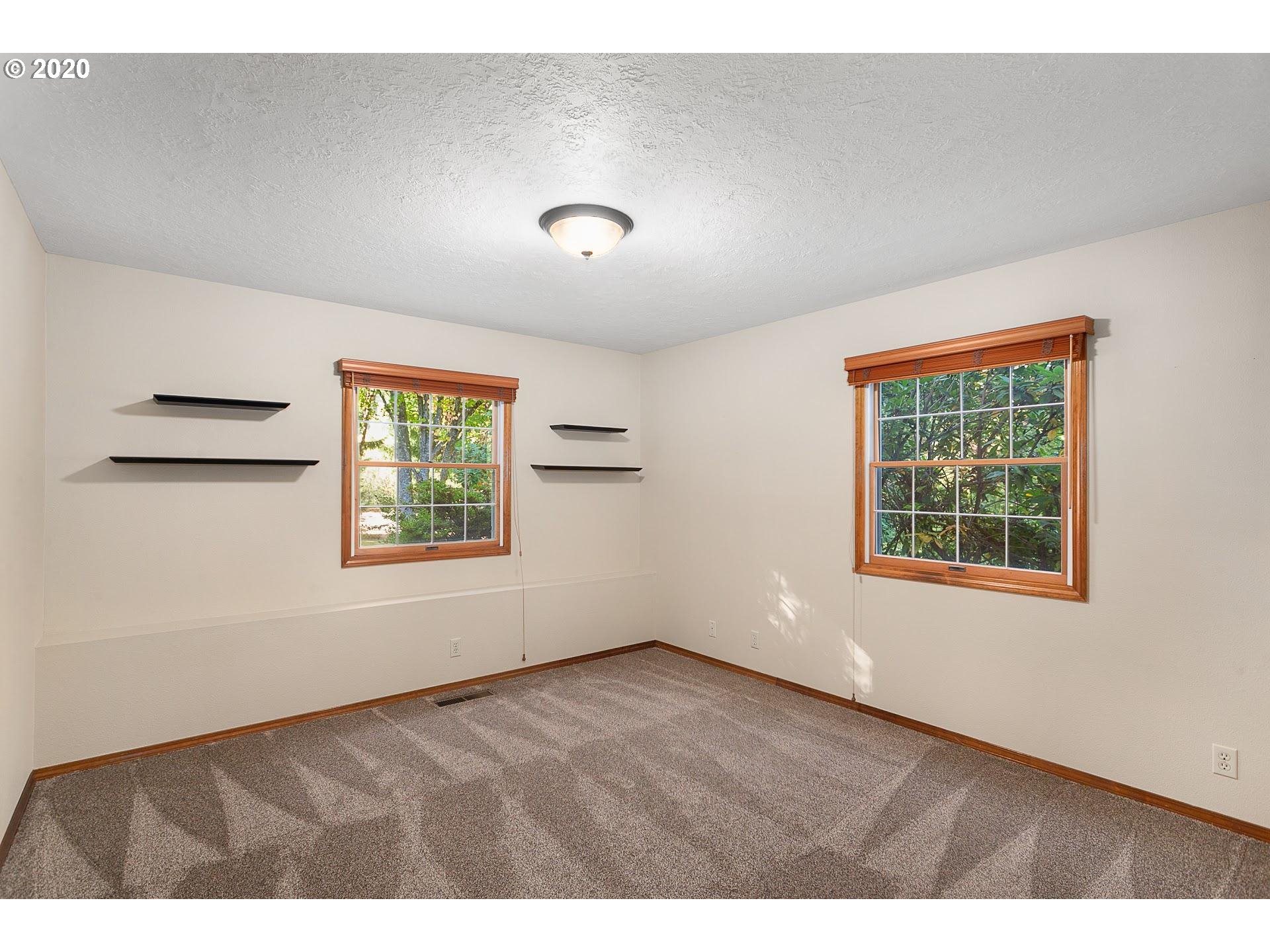18740 Southwest Seiffert Road Sherwood, OR 97140 - Photo 18 of 32 a view of an empty room with a window