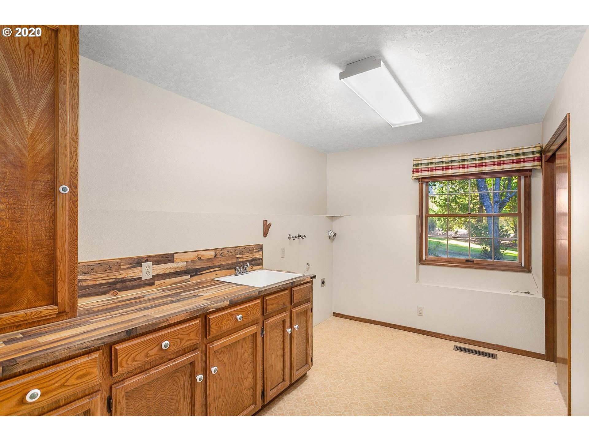 18740 Southwest Seiffert Road Sherwood, OR 97140 - Photo 19 of 32 a kitchen with a sink and a window