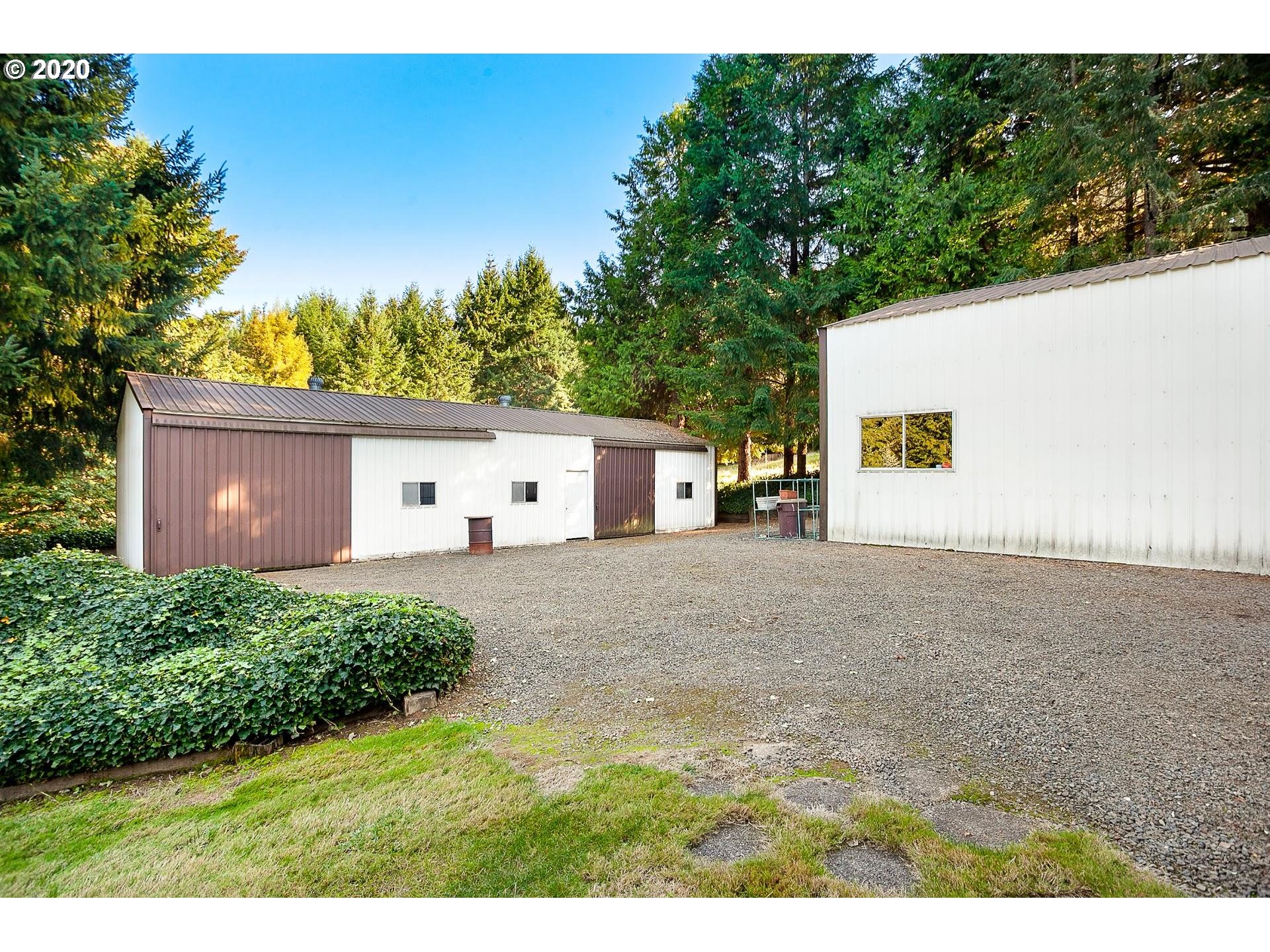 18740 Southwest Seiffert Road Sherwood, OR 97140 - Photo 24 of 32 a view of a house with a yard and a garage