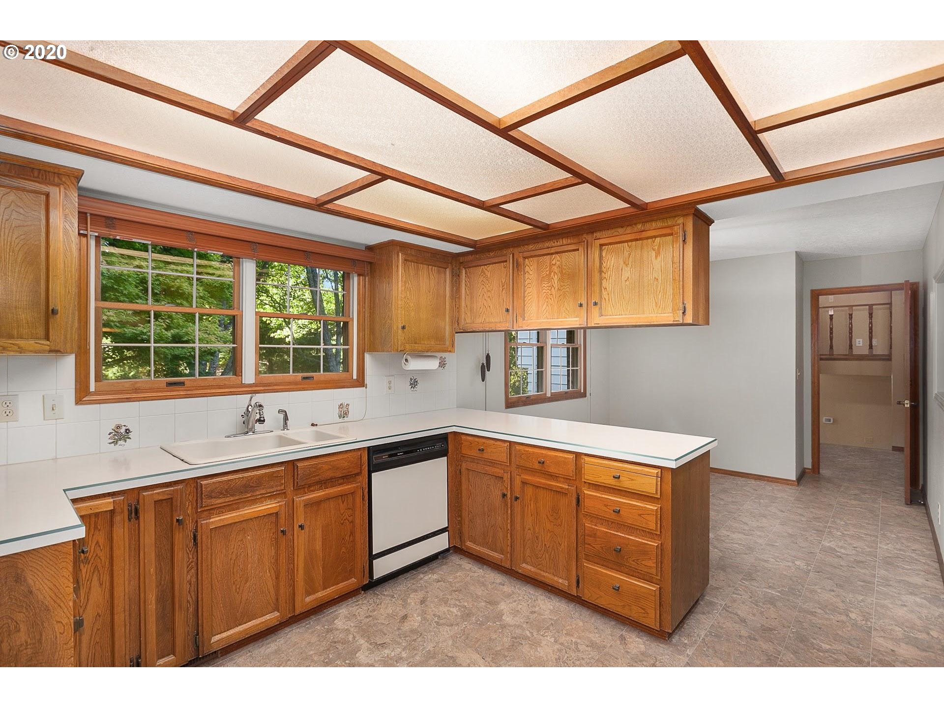 18740 Southwest Seiffert Road Sherwood, OR 97140 - Photo 8 of 32 a kitchen with a sink window and cabinets