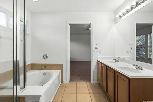 a bathroom with a sink a vanity and a mirror
