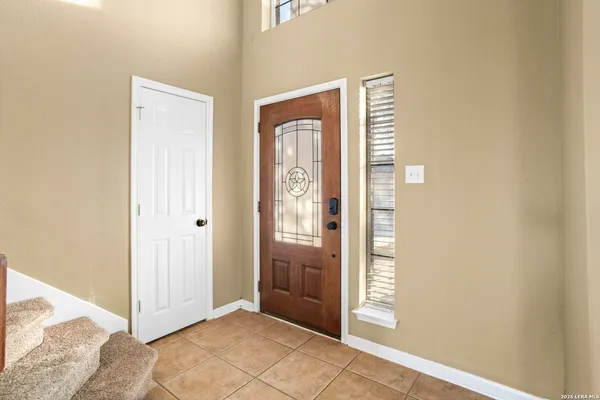a view of wooden floor and window in a room