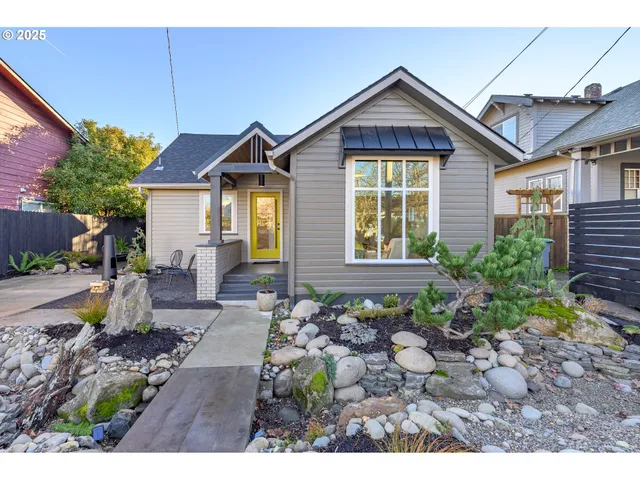 a front view of a house with garden
