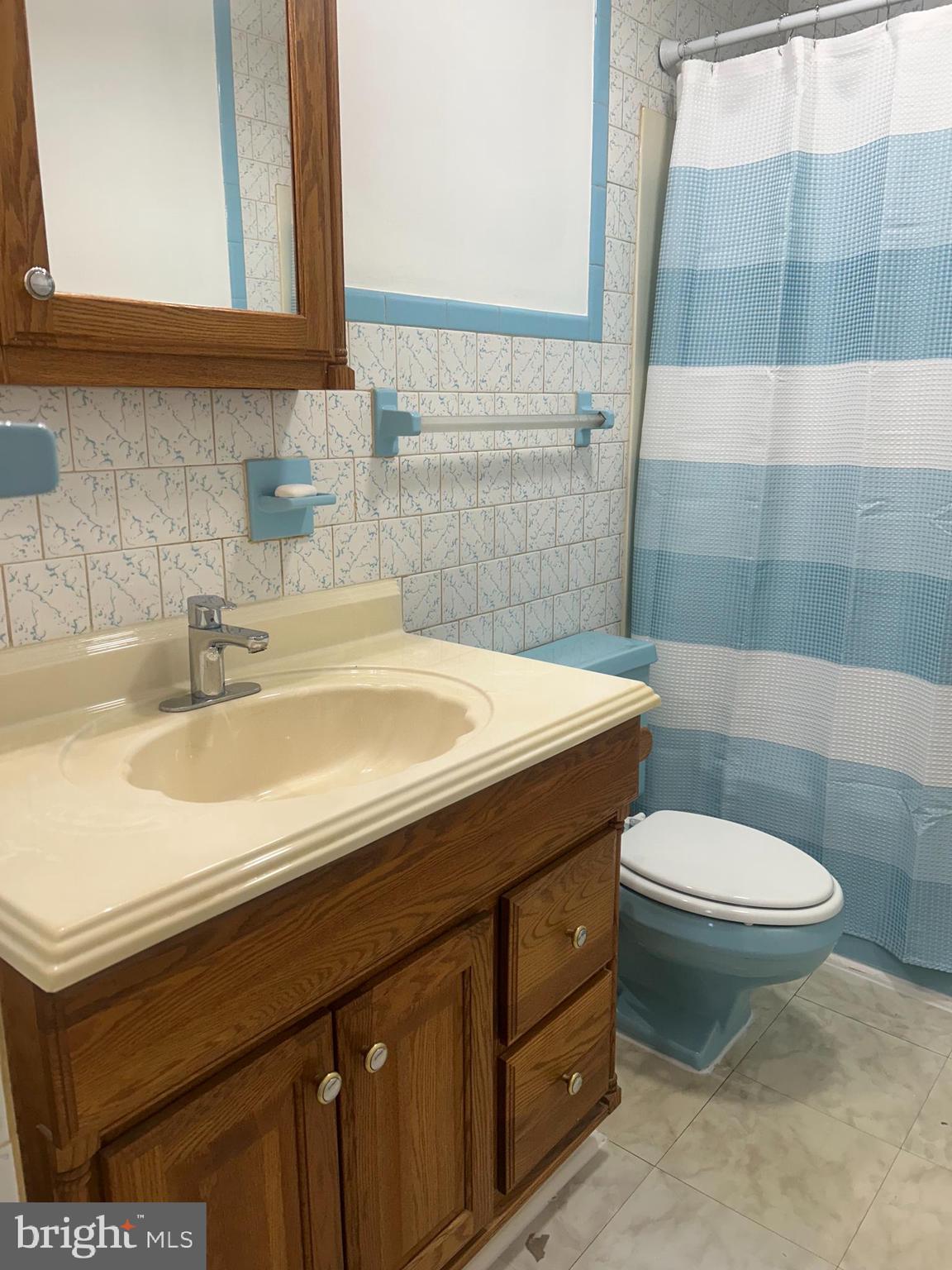 304 Barksdale Road Joppa, MD 21085 - Photo 19 of 24 a bathroom with a sink and a toilet