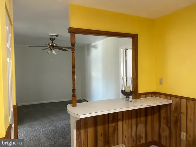 a kitchen with stainless steel appliances a stove a sink and a microwave