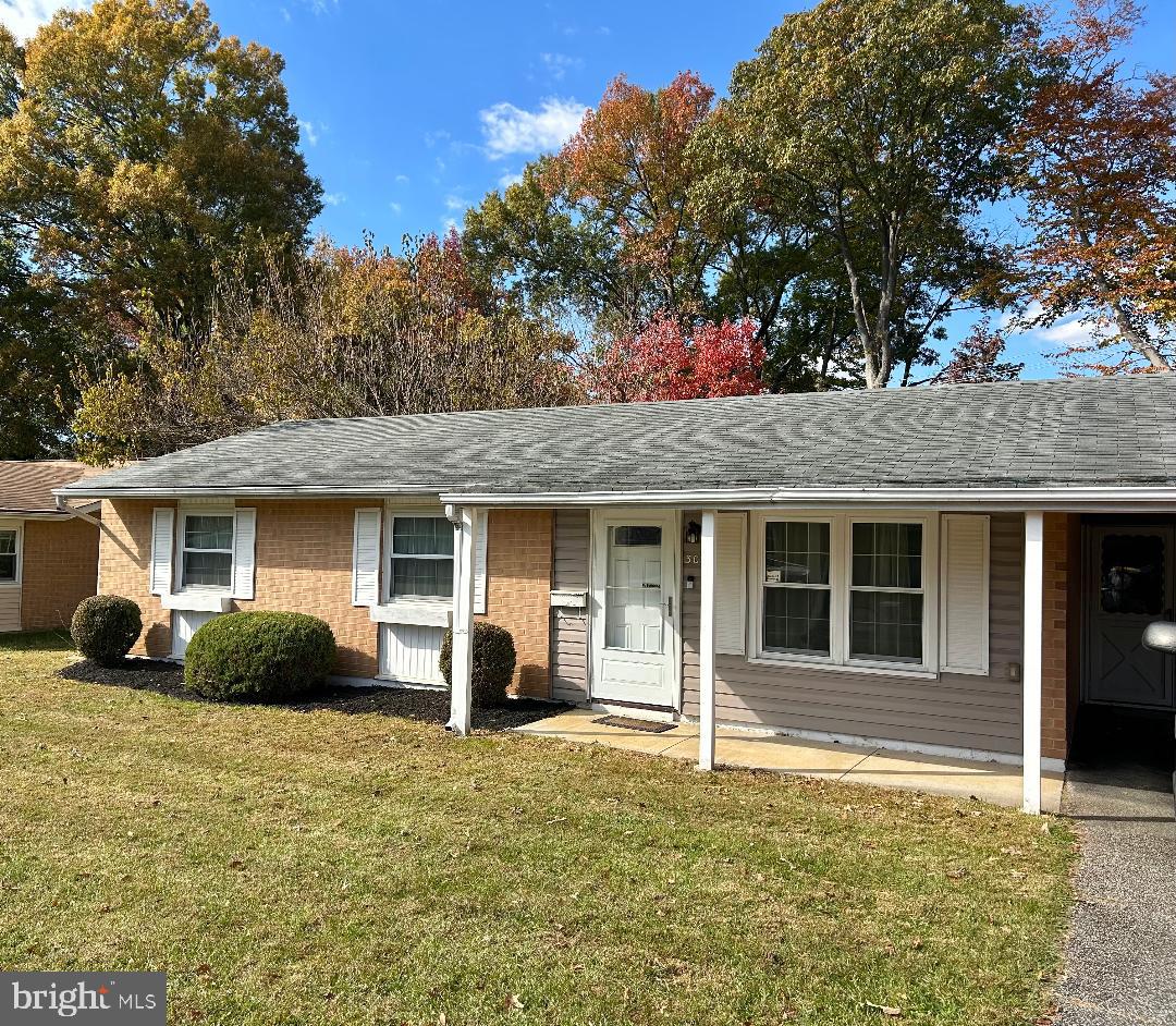 304 Barksdale Road Joppa, MD 21085 - Photo 3 of 24 a house that has a tree in front of it