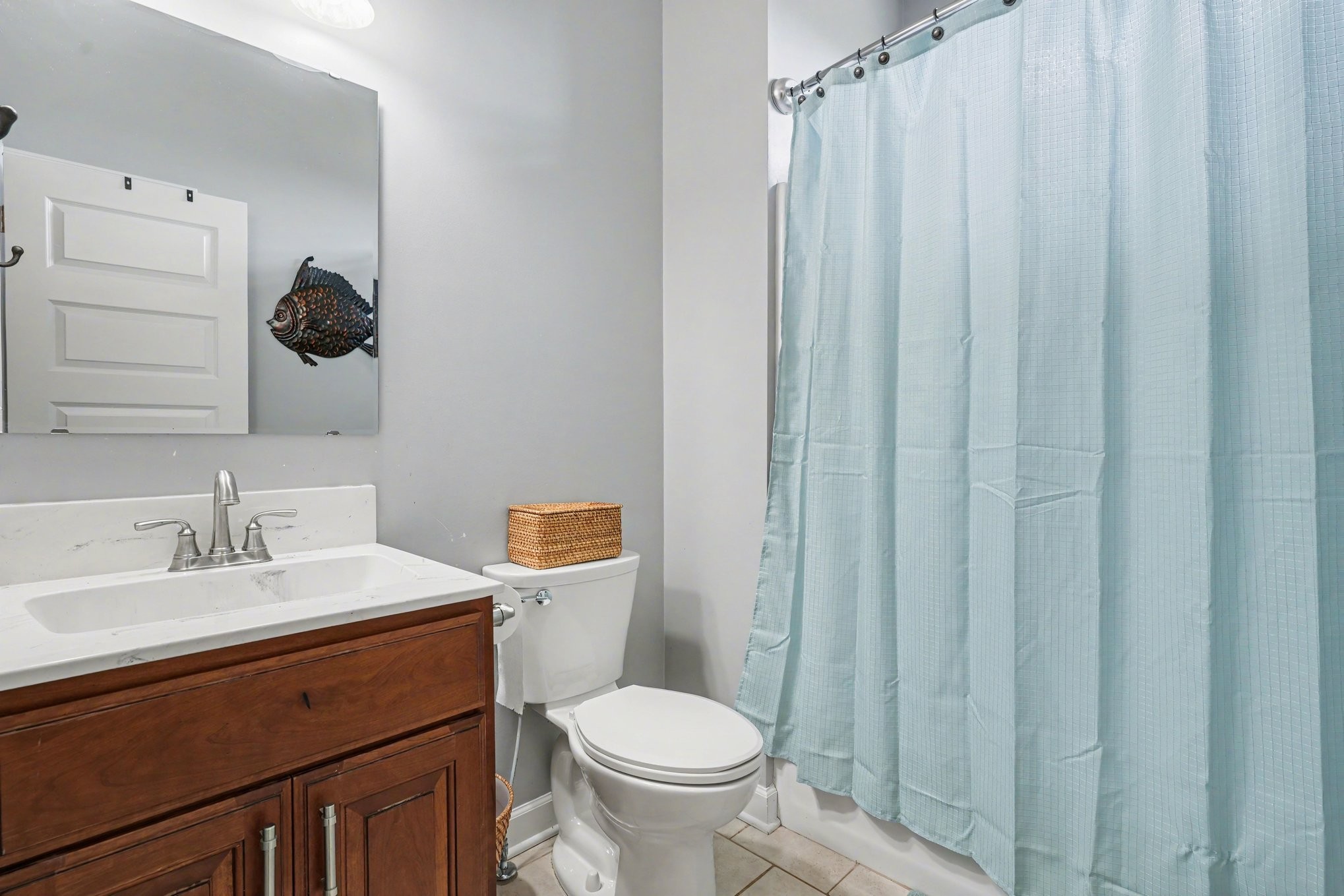 948 Goslin Branch Road Burns, TN 37029 - Photo 16 of 37 a bathroom with a sink a toilet and shower curtain