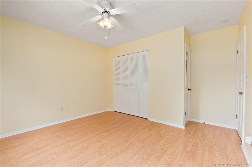 2493 Southwest Murphy Road Palm City, FL 34990 - Photo 15 of 50 wooden floor in an empty room