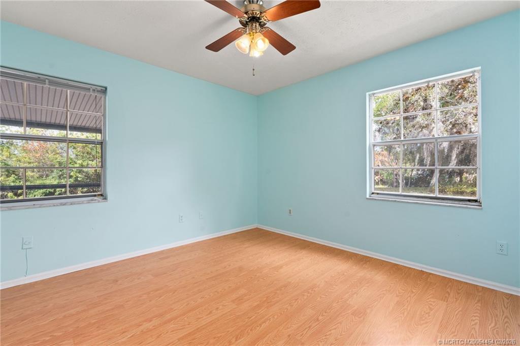 2493 Southwest Murphy Road Palm City, FL 34990 - Photo 21 of 50 a view of an empty room with a window