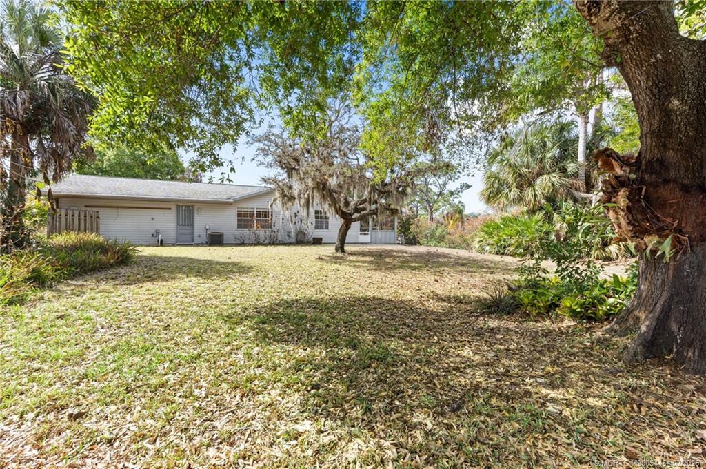 2493 Southwest Murphy Road Palm City, FL 34990 - Photo 3 of 50 a house view with swimming pool