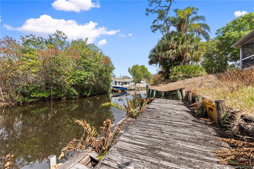 2493 Southwest Murphy Road Palm City, FL 34990 - Photo 38 of 50 a view of a lake with a mountain