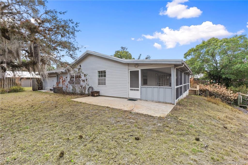2493 Southwest Murphy Road Palm City, FL 34990 - Photo 43 of 50 a view of a house with a yard