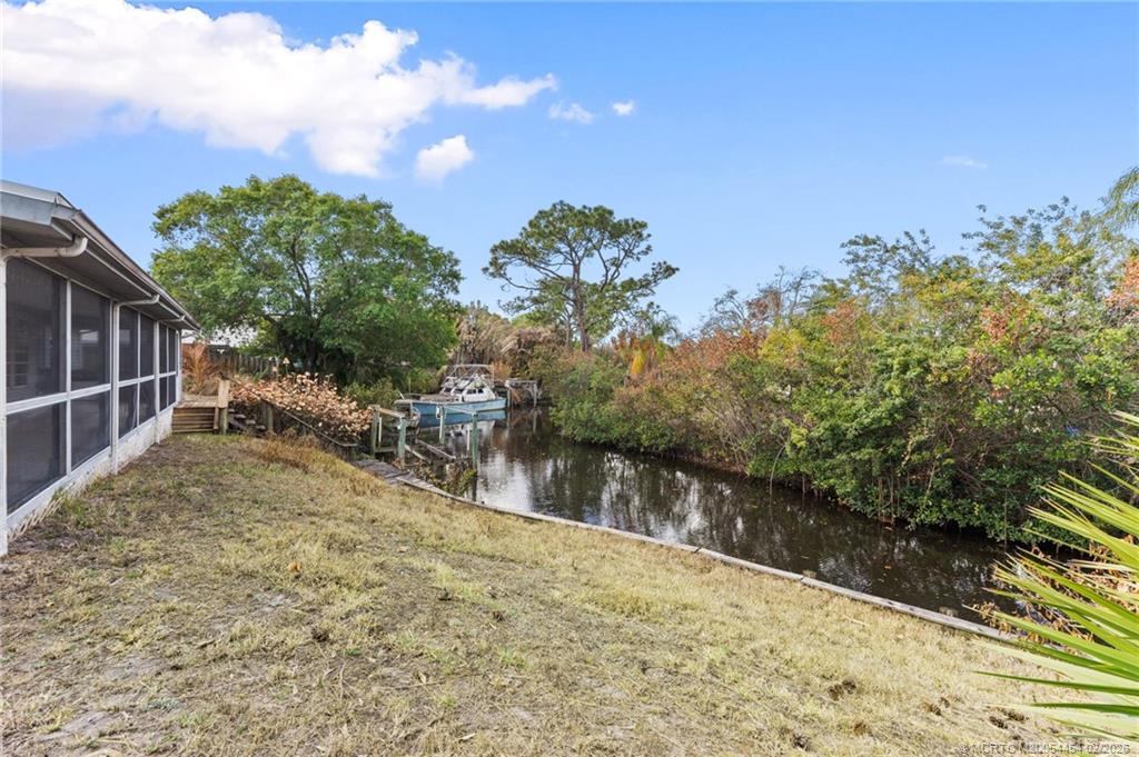 2493 Southwest Murphy Road Palm City, FL 34990 - Photo 44 of 50 a view of a yard with wooden fence