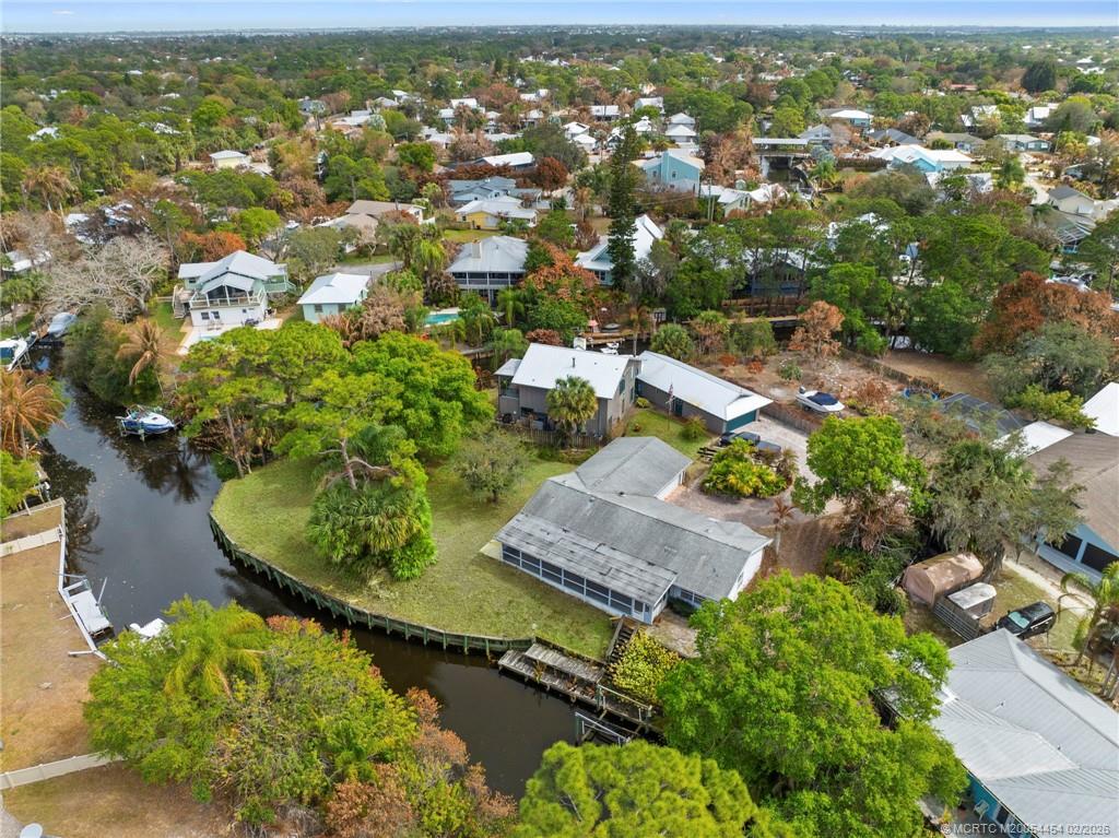 2493 Southwest Murphy Road Palm City, FL 34990 - Photo 45 of 50 an aerial view of residential houses with outdoor space and trees