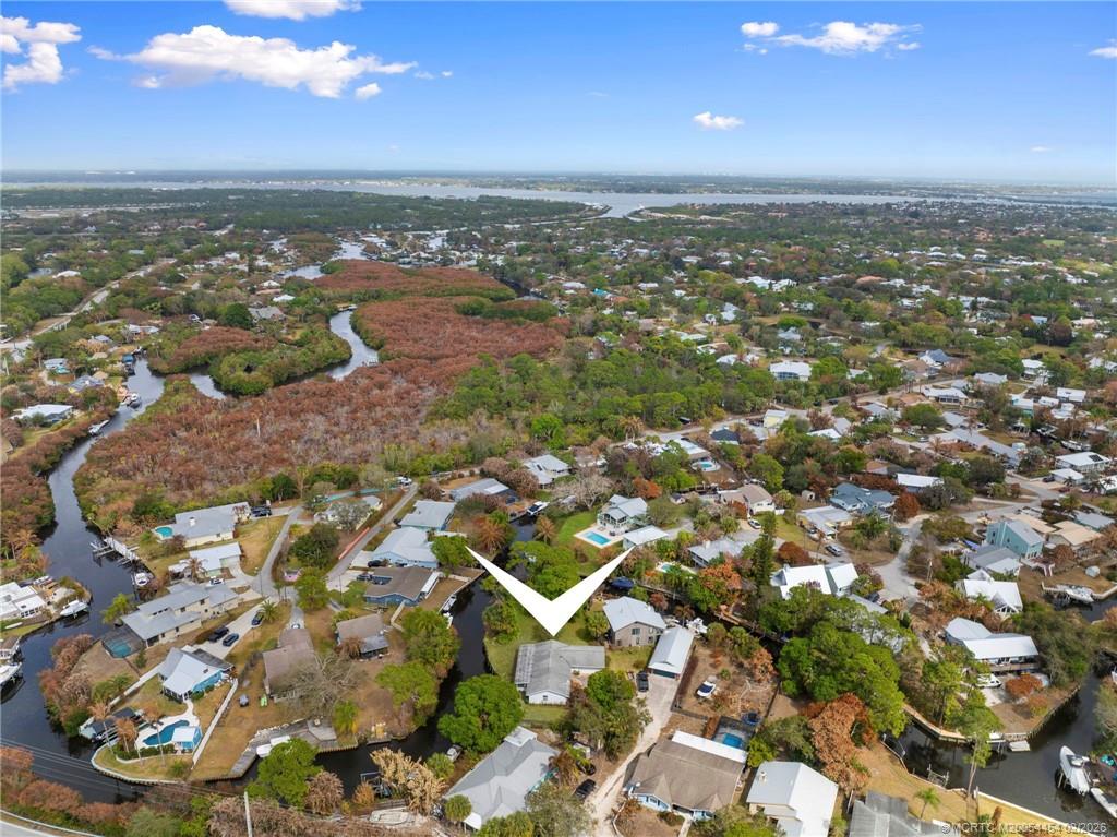 2493 Southwest Murphy Road Palm City, FL 34990 - Photo 47 of 50 an aerial view of residential houses with outdoor space