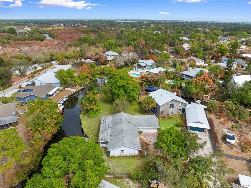 2493 Southwest Murphy Road Palm City, FL 34990 - Photo 50 of 50 an aerial view of a city with lots of residential buildings
