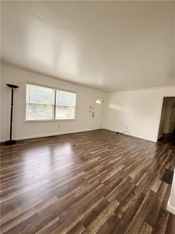 3151 Bluebird Lane Decatur, GA 30032 - Photo 12 of 16 an empty room with wooden floor and windows