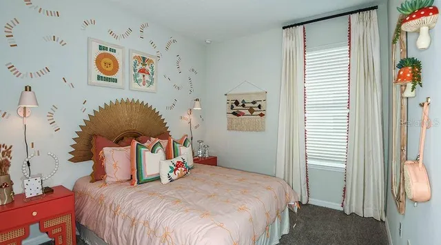 a bed room with a bed and a large mirror