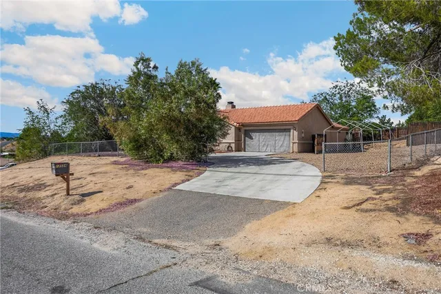 a yellow and red house with a trees